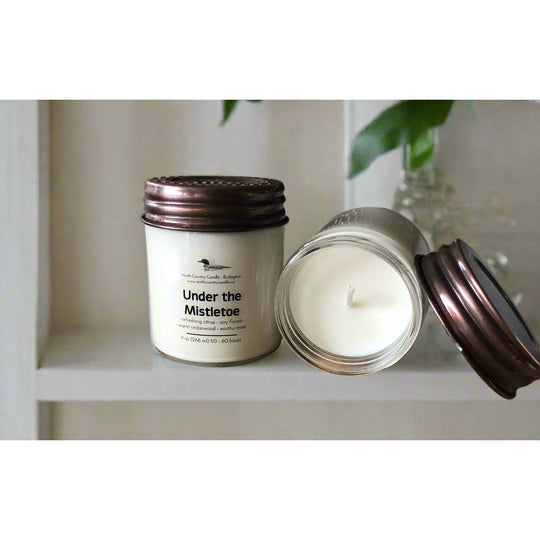 9 oz soy candle with Mason jar lid scented with Under the Mistletoe.