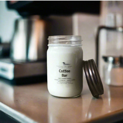 Best selling Coffee Bar scented soy wax candle in 12 oz jar with burnished copper Mason jar lid.