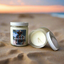 Load image into Gallery viewer, 9 oz soy wax candle in clear jar with summer scent name Beach Bum. A blend of ocean and soft florals.
