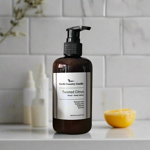 8 oz Hand + Body Moisturizer in amber bottle scented Twisted Citrus