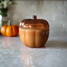 Load image into Gallery viewer, 20 oz orange glass pumpkin with lid poured with eco-friendly soy wax
